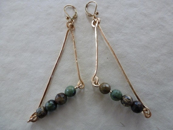 Hand forged gold sticks and green opal stones triangulate naturally as Sticks And Stones Earrings.
