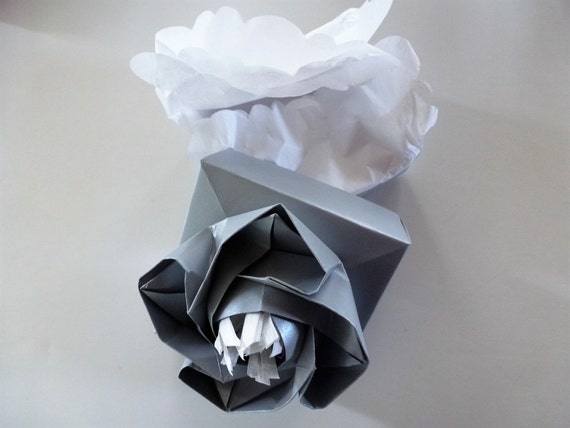 The Wedding Origami Rose Box In Silver Heavy Cardstock With White Scalloped Tissue Paper And White Raffia Stamens Attaching Rose To Box