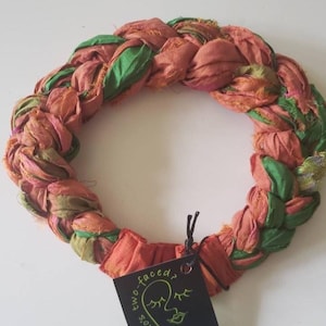 Grassy greens woven with soft orange and random embroidered florals makes a luscious Sari Silk Braided Headband! Adjustable comfort, too!