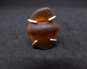 Root Beer sea glass bottleneck captured from a Caribbean tide, then captured by the sterling silver prongs of a split shank ring for you!
