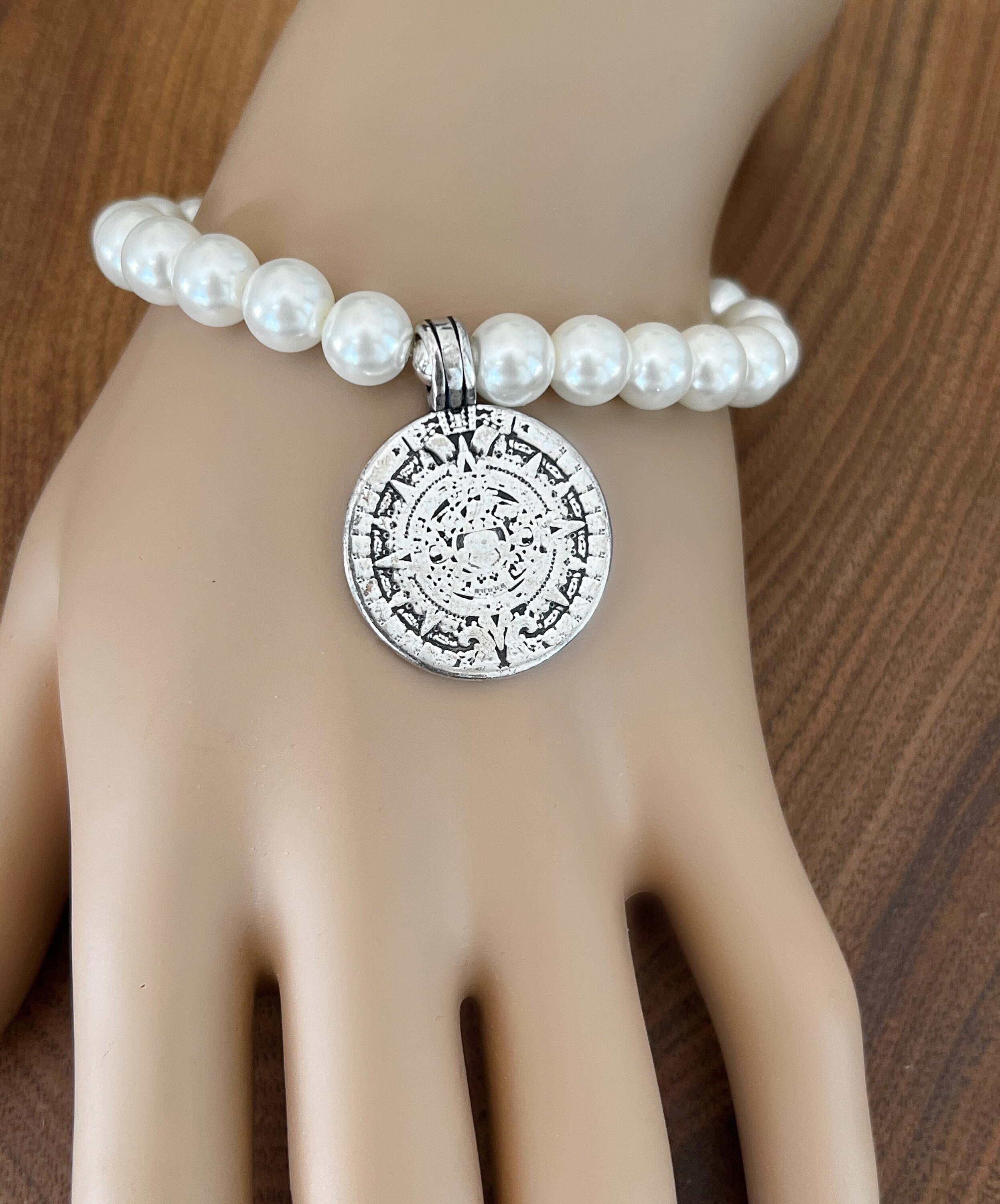Image of Mayan pearl bracelet with sun design