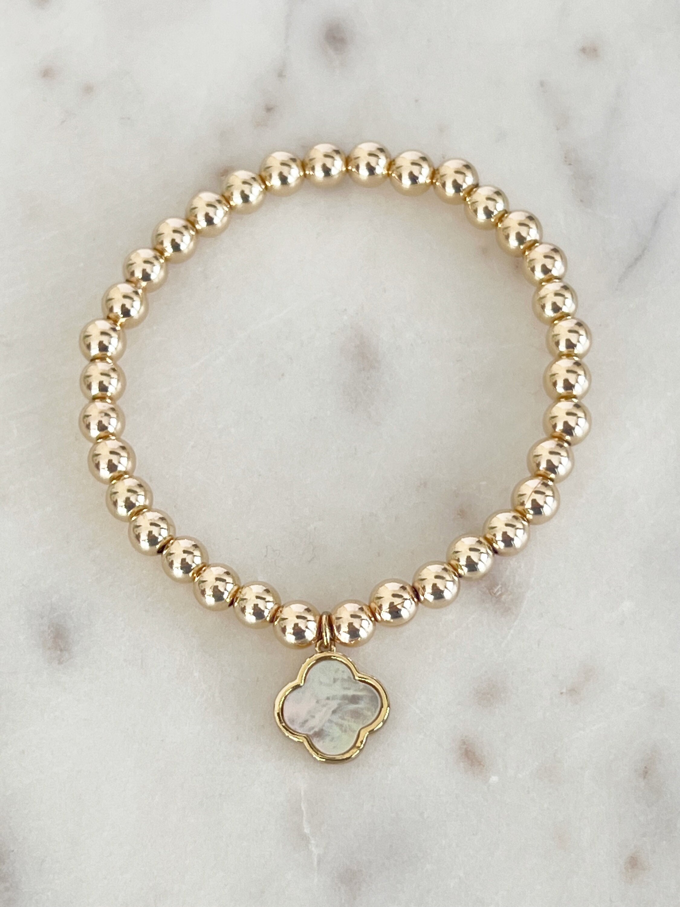 Gold plated chain bracelet with mother of pearl clover 