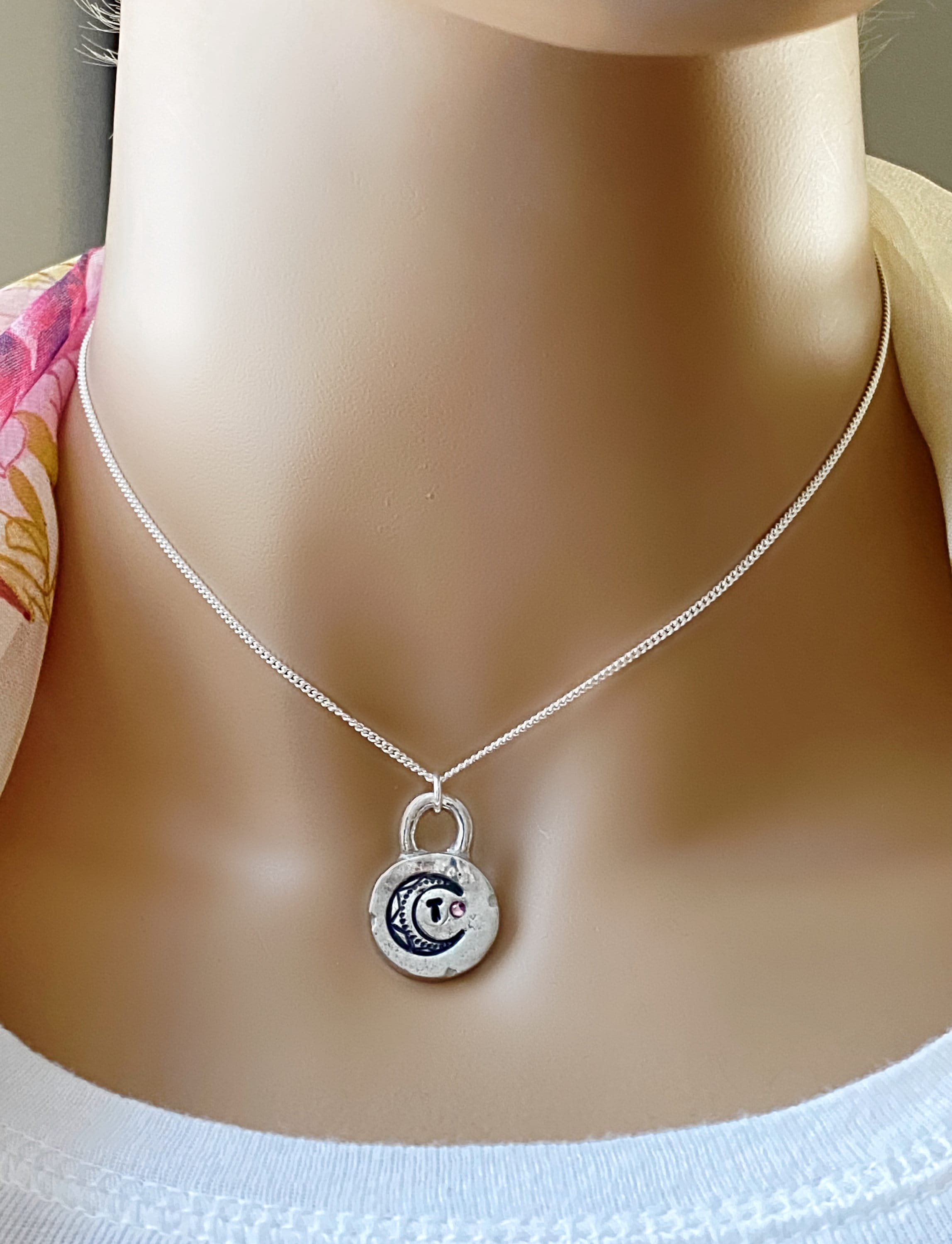 Shown in sterling silver with turquoise. Layered charm necklace with hand stamped initial and birthstone
