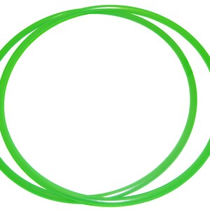 May include: Two bright green plastic hoops, one slightly larger than the other, are stacked together. The hoops are flexible and appear to be made of a lightweight material.