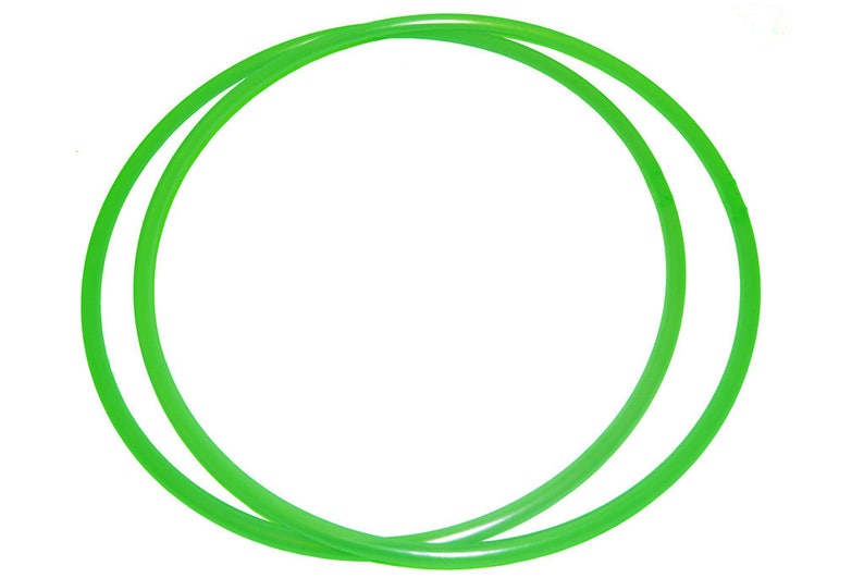 May include: Two bright green plastic hoops, one slightly larger than the other, are stacked together. The hoops are flexible and appear to be made of a lightweight material.