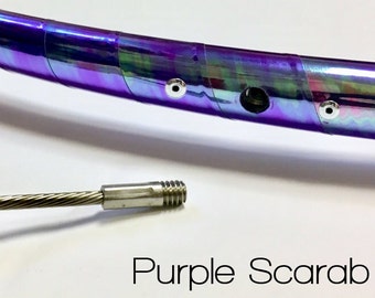 May include: A close-up of a purple iridescent hoop with silver accents and a silver cable with a threaded end. The text "Purple Scarab" is visible below the hoop.