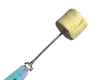 May include: A close-up of a fire spinning prop with a yellow, woven wick attached to a silver metal rod.