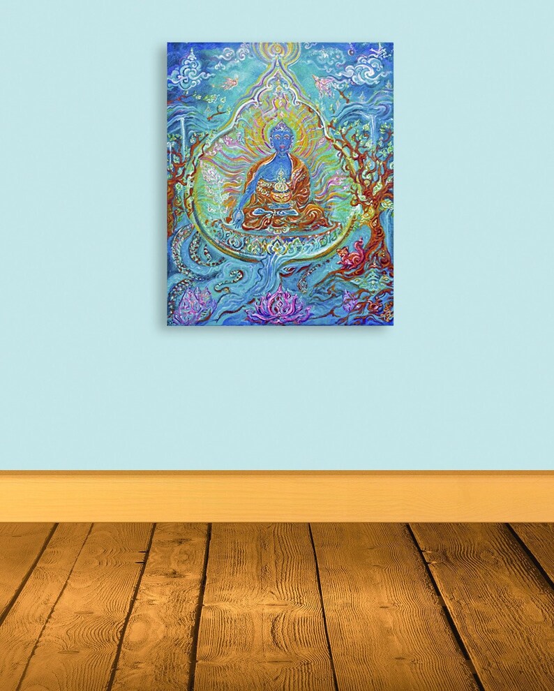 May include: A painting of a blue Buddha sitting in a lotus position with a golden halo. The Buddha is surrounded by a blue and green mandala with flowers and other symbols. The painting is on a white background.