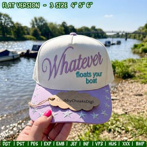 May include: A white and light purple baseball cap featuring the embroidered text "Whatever floats your boat" in purple and teal. The brim is light purple with embroidered white stars and a brown cloud-shaped tag labeled "ChubbyCheeksDigi".