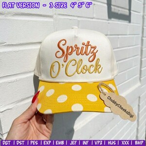 May include: A white baseball cap with a yellow brim featuring white polka dots. The front panel displays the embroidered text Spritz O'Clock in orange and yellow script. A tan tag attached to the brim reads ChubbyCheeksDigi. Text at the top reads FLAT VERSION - 3 SIZE 4" 5" 6".