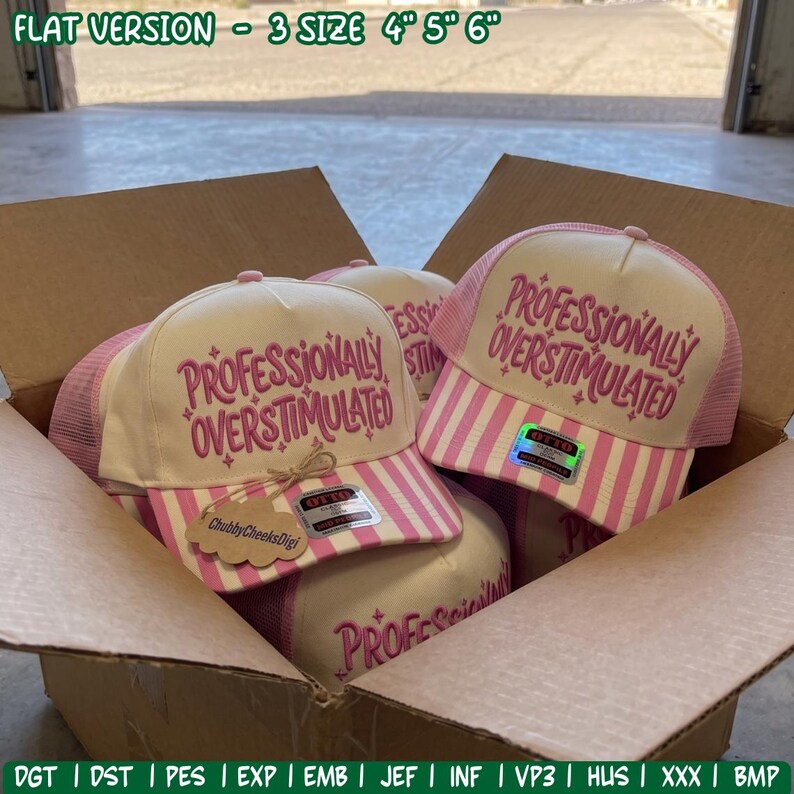 May include: Trucker hats with cream-colored front panels and pink and white striped brims. The text "PROFESSIONALLY OVERSTIMULATED" is embroidered in pink on the front. The hats feature pink mesh backs and include tags. Text at top: "FLAT VERSION - 3 SIZE 4" 5" 6"."