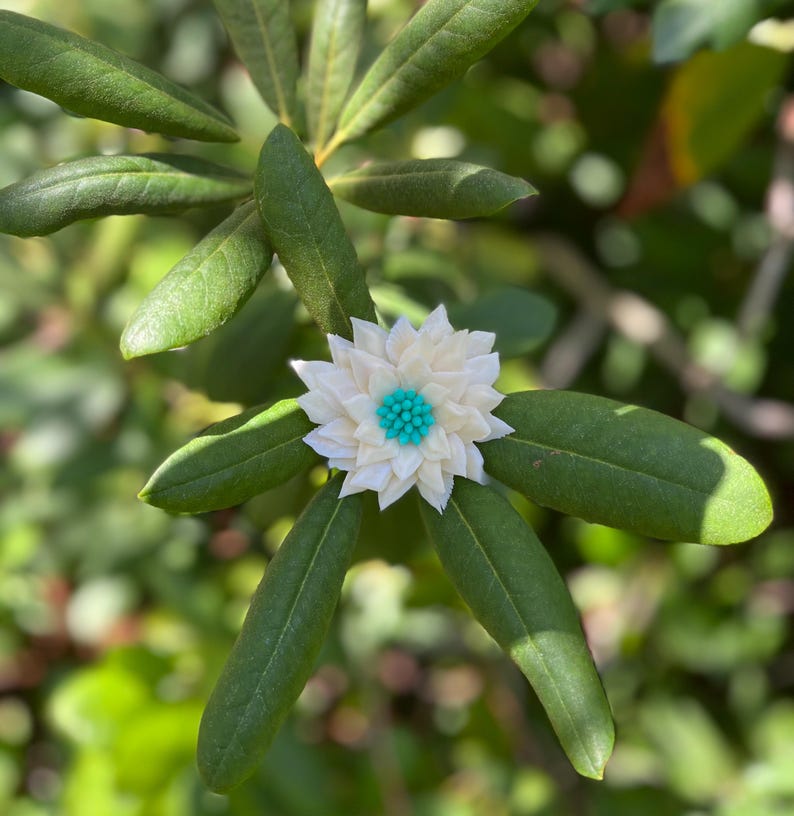 Eine von einer Art komplizierten Seashell Flower Stem Bild 15