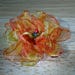 Catherine Pasacreta reviewed Yellow and orange iridescent organza flower pin with glass beading.