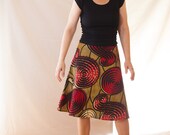 The item on the photo is sold. Ask us for new patterns for the African wax print A-Line skirt.