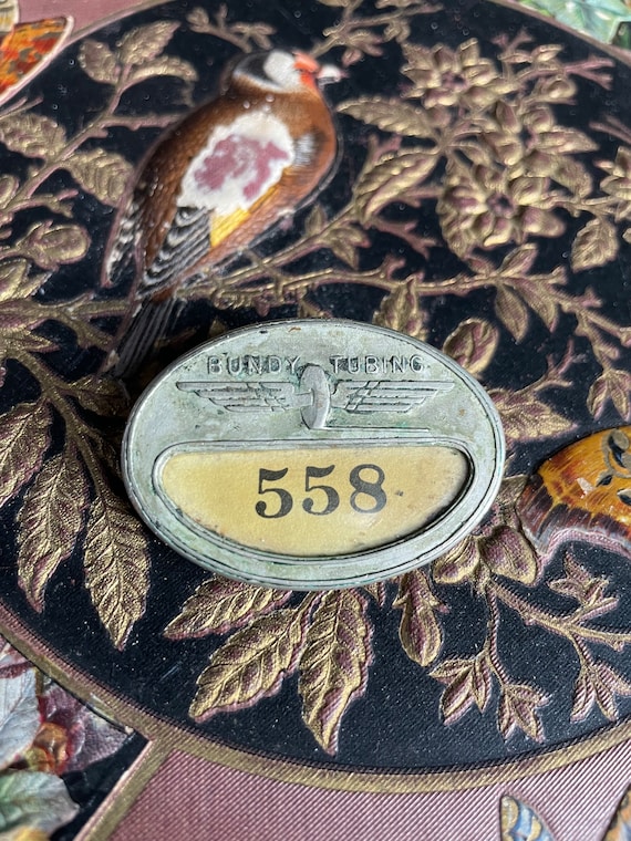 Antique Bundy Tubing Employee Metal Pin Badge #558