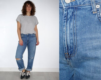 Retro women's blue ripped jeans