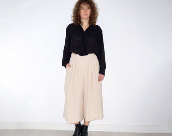 Vintage women's black floral oversized shirt with button down back