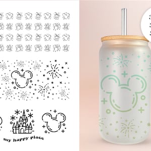 May include: A clear glass tumbler with a bamboo lid and a straw. The tumbler has a design of Mickey Mouse ears, fireworks, and stars in green and white. The text "my happy place" is printed on the bottom of the tumbler.