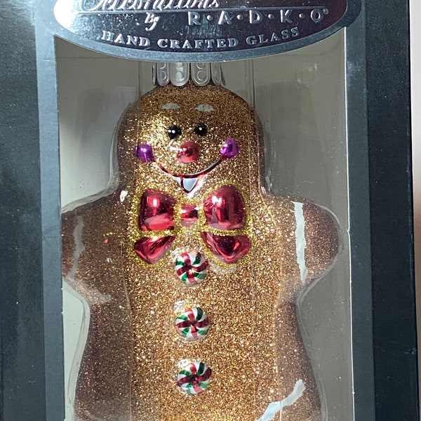 2013 Christopher Radko Celebrations Hand Crafted Glass Gingerbread Man Ornament with Bow Tie. In Original Box.  Like New Condition.