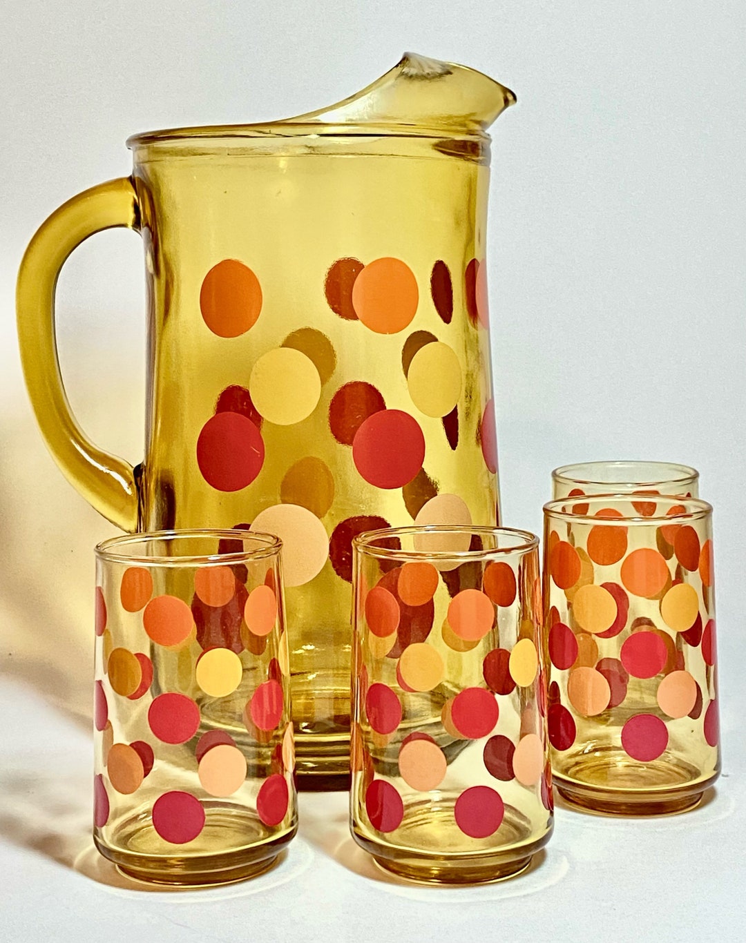 Vintage Amber Polka Dot Ice Lip Pitcher and Four Juice Glasses. the