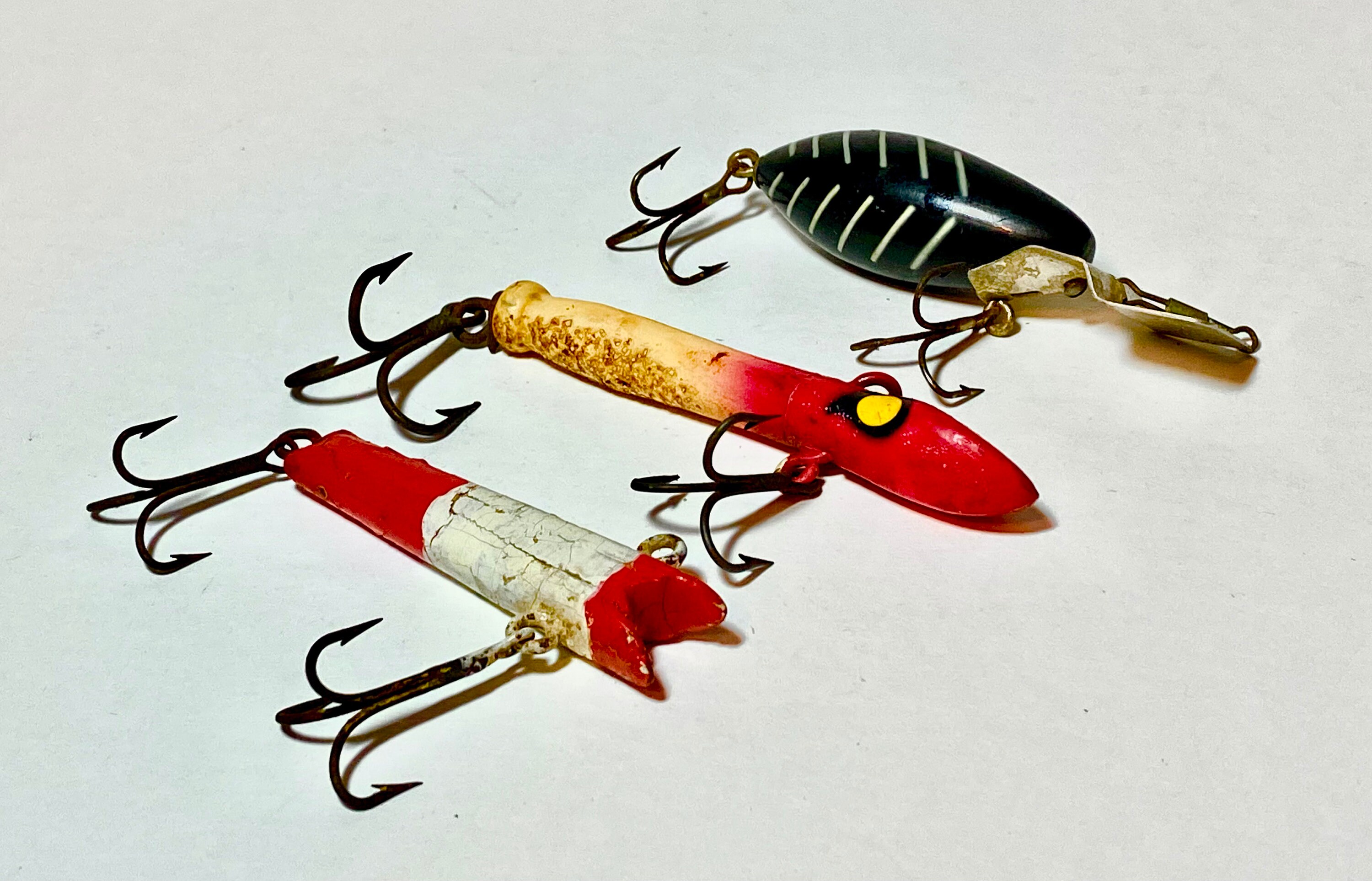 Three Vintage Fishing Lures-di Dipper, Seahawk and 1 Wooden