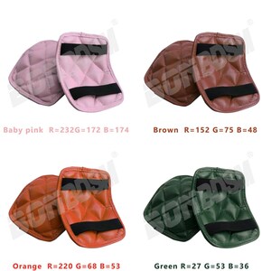 May include: Four pairs of quilted elbow pads in different colors: baby pink, brown, orange, and green. Each pair has a black elastic strap.