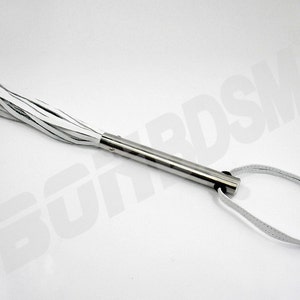 May include: A white leather whip with a silver handle and a loop at the end.
