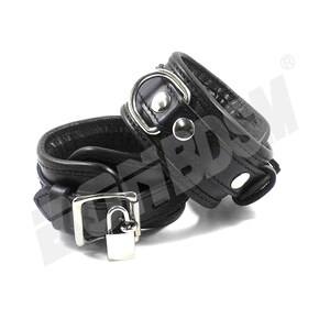 May include: A pair of black leather wrist cuffs with a silver lock and metal hardware. The cuffs are connected by a silver chain.