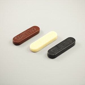 May include: Three shoe polish bars, one brown, one white, and one black. The brown bar says "SHOE POLISH", the white bar says "COLLONIL", and the black bar says "COLLONIL".