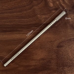 May include: A silver metal tool with a textured grip and the text "Nattools" engraved on the side. The tool is 120 mm long and 6 mm wide.