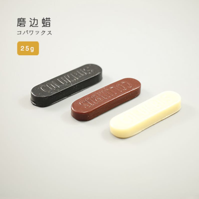 May include: Three shoe polish sticks, one black, one brown, and one white. The sticks are labeled "COLLONIL" and "SAPHIR" in black lettering.