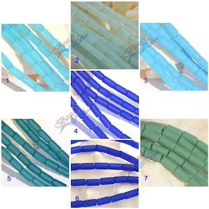 May include: Seven rows of glass beads in various shades of blue and green. The beads are cylindrical and have a frosted finish. The beads are arranged in rows, with each row containing a different color. The beads are labeled with numbers 1 through 7.