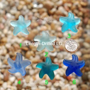 May include: Six sea glass starfish beads in various shades of blue, with a hole drilled through the top for stringing. The beads are arranged in a row, numbered 1 through 6. The text "Length-Drilled LG" is visible in the image.