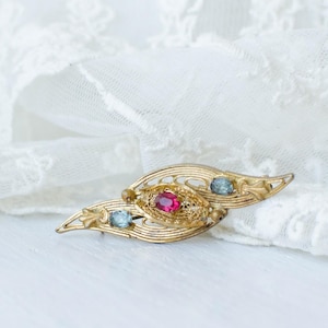 Art deco openwork Czech Vintage brooch with blue and pink crystals