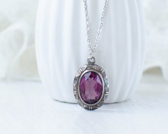 Vintage pendant with violet glass crystal