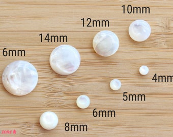 May include: Assortment of white mother of pearl cabochons in various sizes, ranging from 4mm to 16mm. The cabochons are round and have a smooth, polished surface.