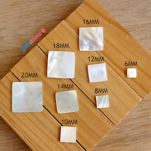 May include: Assortment of white mother of pearl square tiles in various sizes, ranging from 6mm to 20mm. The tiles are arranged on a wooden surface.