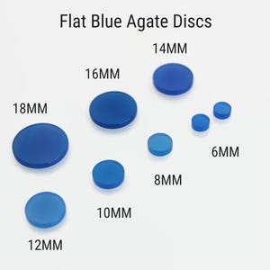May include: A collection of flat, blue agate discs in various sizes, ranging from 6mm to 18mm, are shown against a white backdrop. The image is labelled "Flat Blue Agate Discs".