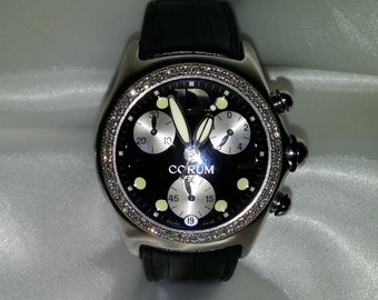 Corum Bubble Chronograph,    2 Row Diamond Bezel. Black Dial, Black leather bracelet,  Quartz