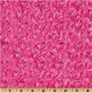 May include: Pink fluffy fabric with a rose pattern. The fabric is soft and plush, perfect for making blankets, pillows, or other crafts.