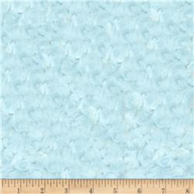 May include: Light blue fabric with a white and light blue abstract pattern. The pattern resembles small, swirling shapes.