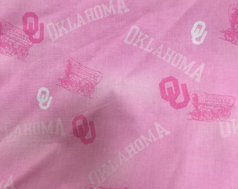 Pink Oklahoma Sooners cotton fabric.