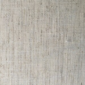 May include: Close-up of a natural woven fabric with a rough texture. The fabric is a light beige color and has a subtle pattern.