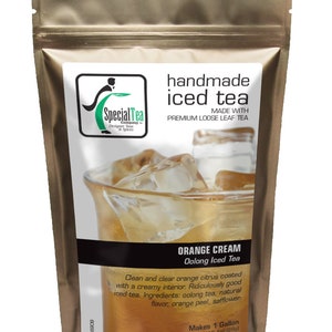 May include: A brown pouch with a zipper closure, containing a blend of loose leaf tea for making iced tea. The pouch features a label with the text "Special Tea Company" and "handmade iced tea". The label also includes a glass of iced tea with ice cubes and the text "Orange Cream Oolong Iced Tea". The text "Makes 1 Gallon, Net Wt 1 oz (28g)" is also on the label.