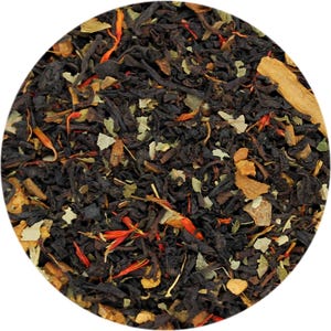 May include: Close-up of loose leaf tea blend. The tea leaves are dark brown and black, with visible pieces of cinnamon, orange, and green herbs. The blend is a mix of textures and colors, creating a visually appealing product.