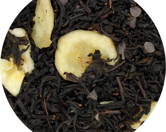 May include: Close-up of black tea leaves with dried banana slices and chocolate chips.