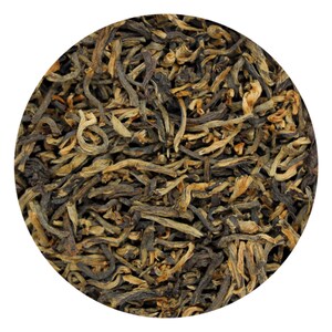 May include: Close-up of loose leaf tea, featuring a mix of dark brown and golden-brown tea leaves. The leaves have a wiry texture and varying lengths, creating a natural and organic appearance. The tea is presented against a white background.