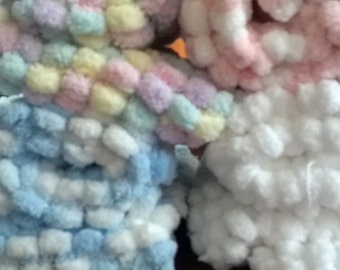 hand knitted pom pom blanket