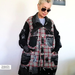 May include: A white ceramic mug with a black handle and the text "But First, Coffee" in a black, bold font. The mug is on a white surface.