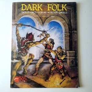 May include: A book cover for the Dungeons & Dragons game module "Dark Folk: Trolls, Orcs, Goblins, Kobolds, Gnolls". The cover features an illustration of a troll fighting two human-like figures in a stone archway.